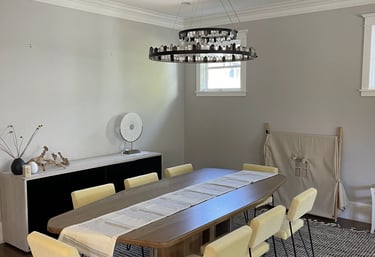 a dining room table with chairs and a table