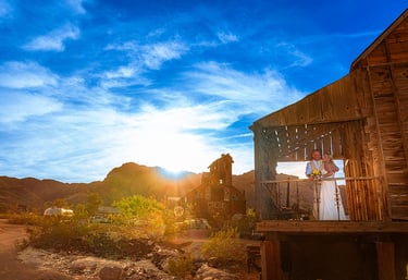 wedding couple pose for a sunset photo at nelson ghost town