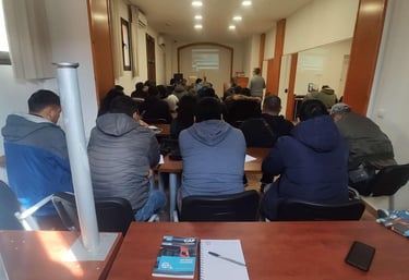 a group of people sitting at a table with papers and papers