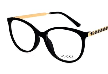 a pair of glasses with a gold metal frame and a black and gold frame