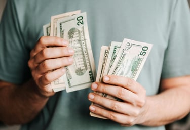 cash in someones hand for augusta precious metals fees
