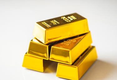 gold bars on white surface