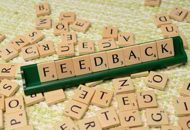 block letters spelling "feedback" for augusta precious metals reviews