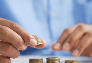 gold coins on table representing beginners guide to gold ira