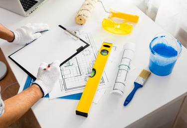 a man is working on a project on a desk