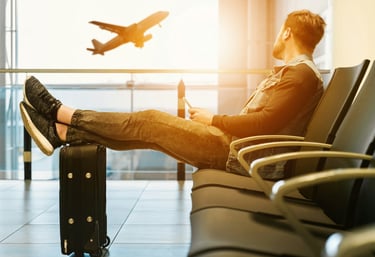 Man resting in lounge, waiting to depart