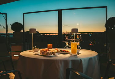 Romantic dinner on the sunset terrace with European cuisine