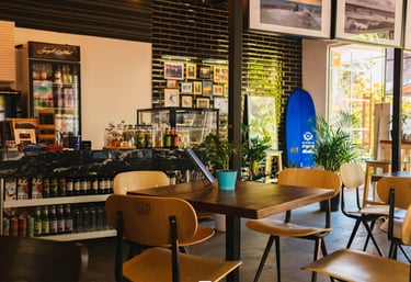 a surfboarder sitting in a restaurant