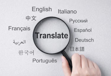 Magnifying glass hovering over the word translate surrounded by various international language names.