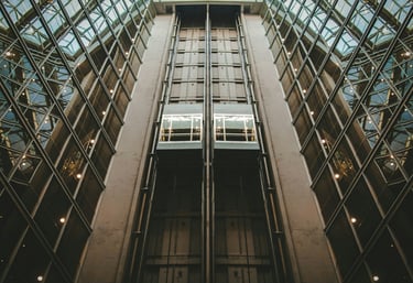 Multiple passenger elevators in commercial building for maintenance services by Stellify Elevators