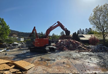 Two excavators sorting debris for recycling