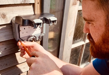 GigaVolt electrician installing an outdoor power socket