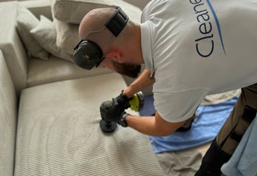 a man in a white shirt is using a camera