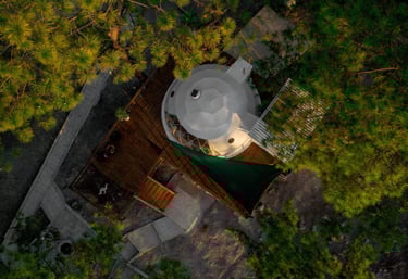 a geo dome with a white top and a white umbrella