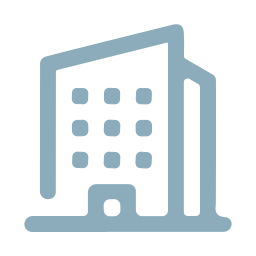A building icon in pale blue colour, to symbolize corporations