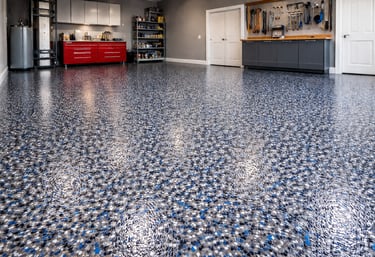 Professional epoxy floor coating installation with decorative flake system for garage.