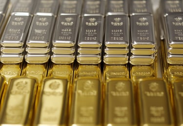 gold and silver bullion bars in rows and stacks