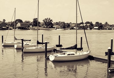 Modern image of Lucas Barcelo and Lucas Soule standing proudly at the marina, overlooking the restored waterfront.