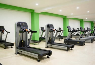 Clean, minimalist gym interior in Abuja featuring high-end cardio equipment, bright and energetic atmosphere with electric green accents and off-white floors, West African / Nigerian urban style.