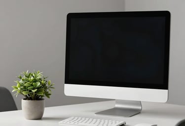 A minimalist office set-up with a high-end desktop monitor and a small potted plant on a clean white desk. Modern and sophisticated. Spanish-speaking / Global.