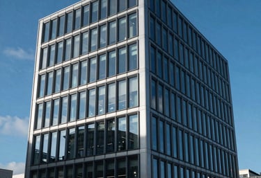 A sleek, contemporary glass office building in a prominent UK business district, reflecting a deep sea blue sky, clean and sophisticated.