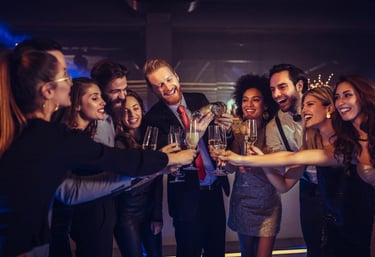 Group celebrating with drinks during a private hip hop crawl nightlife experience in Las Vegas