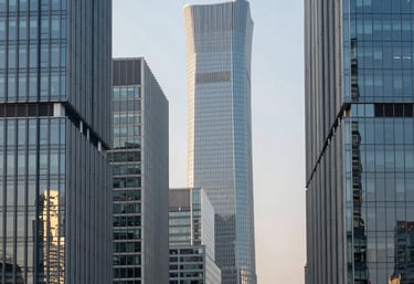A serene morning view of an international business district with modern glass buildings reflecting the light. Steel blue and light grey tones.