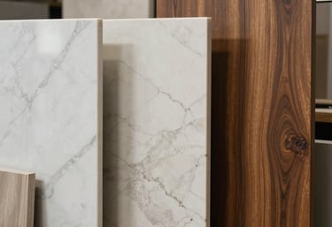 Showcase of premium materials: a selection of marble samples and rich wood cabinet finishes used in a North American / US - Los Angeles studio.