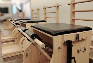Pilates Wunda Chair and Ladder-Barrel convertible equipment. Tirisula Pilates