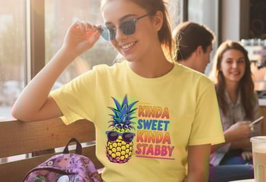 Funny yellow t-shirt: 'Kinda Sweet Kinda Stabby' with a cool pineapple wearing sunglasses graphic.