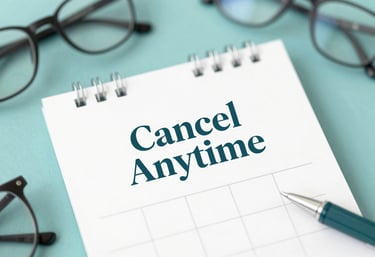 A close-up of a calendar with 'Cancel Anytime' written in elegant typography, surrounded by modern office tools in teal.
