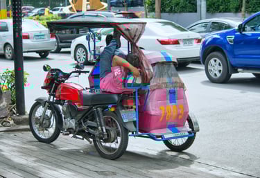 Colorful Filipino tricycle taxi on a busy street, showcasing local transportation and vibrant street life in the Philippines