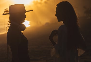 Sophisticated members of the SOLÉ tribe enjoying the golden hour at a luxury Marbella beach club.
