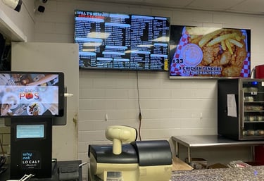 A Tv menu and display inside a restaurant