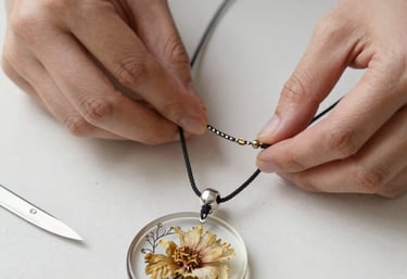 Close-up of a handcrafted resin jewelry piece sparkling under soft light