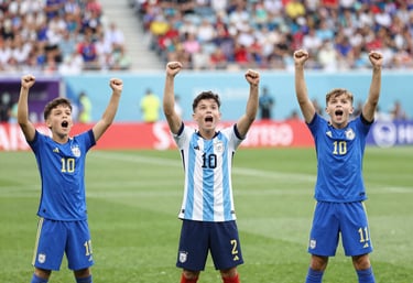 Children happily playing soccer on a sunny field with a coach guiding them.