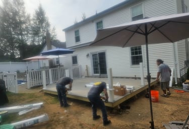 a group of people standing around a deck