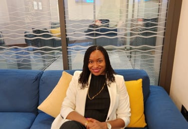 a woman sitting on a couch in a room