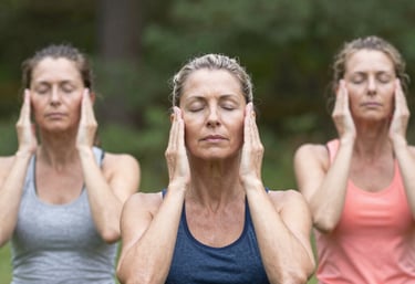 woman covering her face with her hand