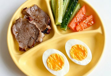 A colorful lunchbox filled with kid-friendly veggies and fruits arranged neatly.