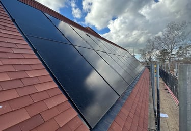 Towcester solar pv installation with Black solar panels installed in a red tile roof