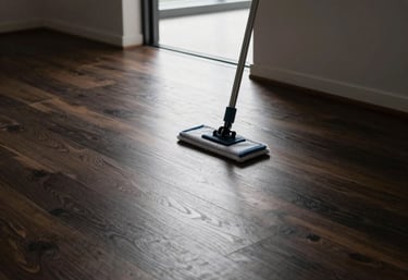 Friendly house cleaner vacuuming the living room rug for a regular client in Tecumseh.
