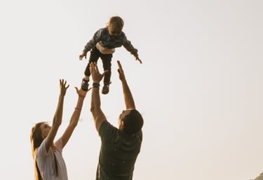 family connecting with young child