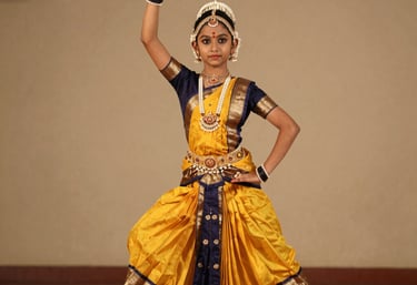 Close-up of colorful dance costume details and expressive hand gestures.