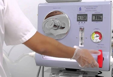 Professional colon hydrotherapy machine being operated by a technician for detoxification.