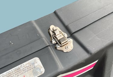 A close up of the locking mechanism on a bike box