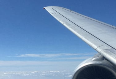 a man riding a skateboard down a street next to tall buildings