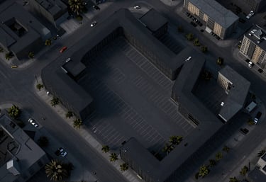 A minimalist site plan drawing showing parking and buildings in shades of black and dark gray, professional urbanization document.