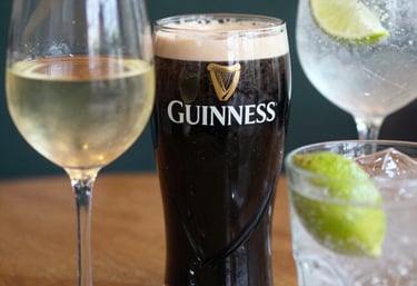 A cozy pub interior with warm lighting, wooden beams, and patrons enjoying their evening.