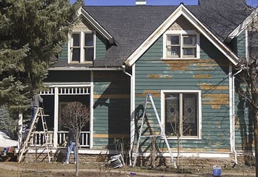 before image of house exterior before being painted. red deer